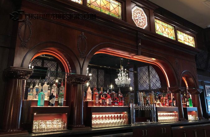 Custom Back Bar with Raised Bottle Displays Custom Back Bar with Raised Bottle Displays