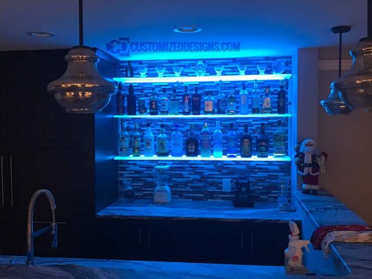 LED Floating Shelves Against Tile Backsplash